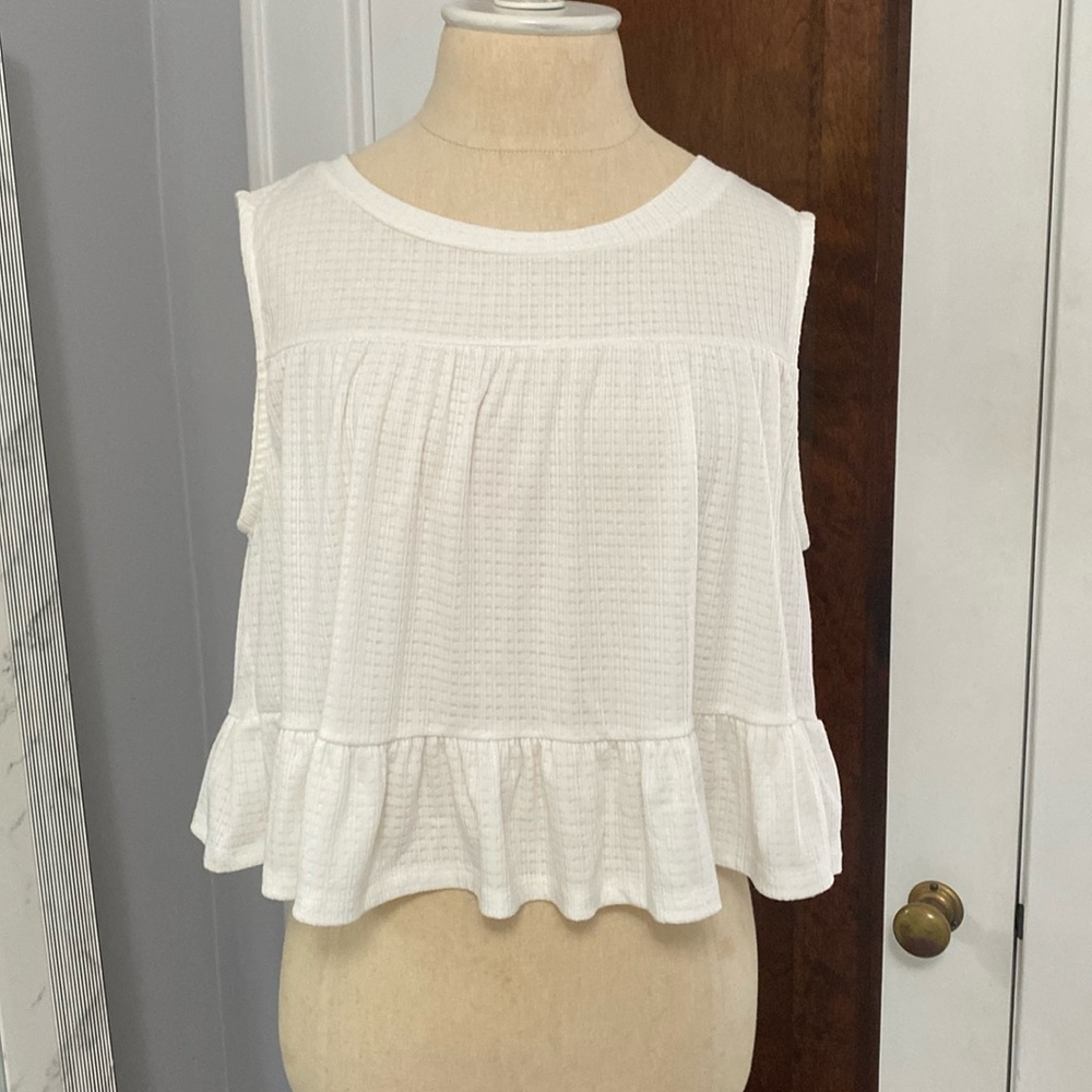 Sleeveless swing ruffle top. Timeless and sweet!